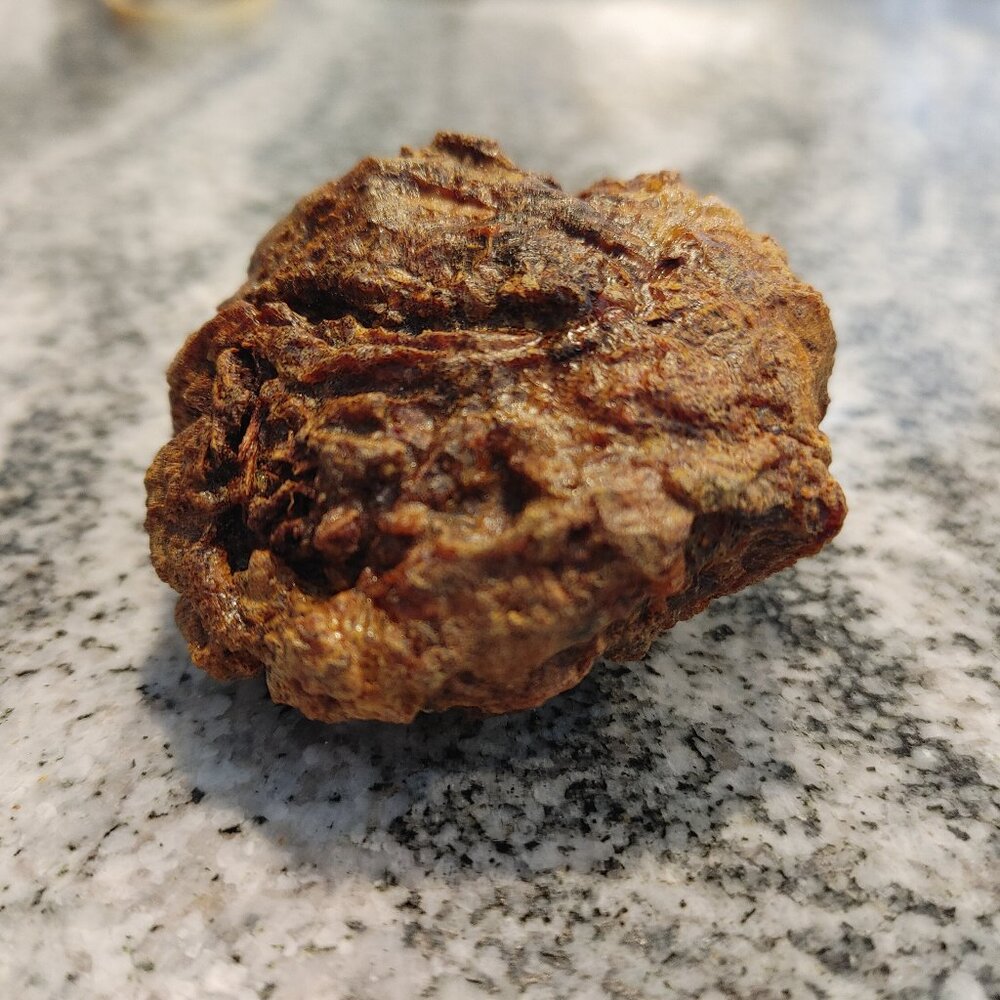 Raw myrrh resin — one large natural aromatic chunk.